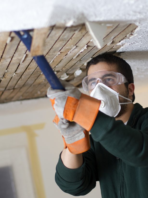Photo of a Man Fixing Ceiling